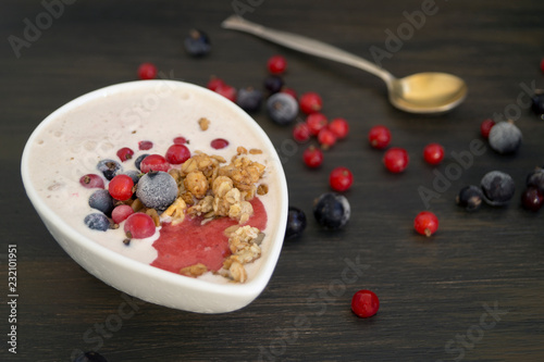 Homemade healthy yogurt with black and red currants