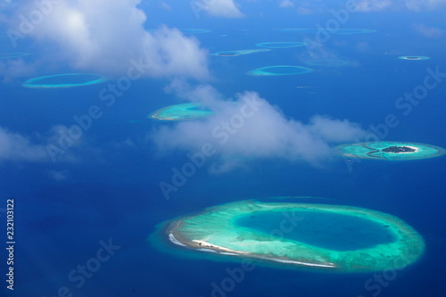 Maldives islands, sky and deep blue ocean