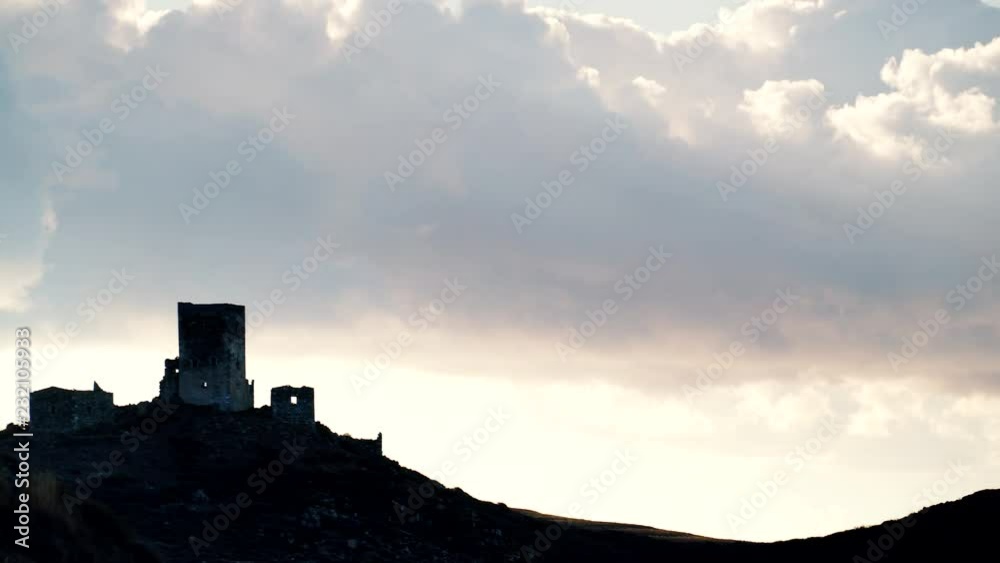Greece Mani Peninsula. Traditional style stone tower house on hill against sky. Laconia Peloponnese, Europe. Time lapse 4K Greece Mani Peninsula. Traditional style stone tower house on hill against sky. Laconia Peloponnese, Europe. Time lapse 4K
