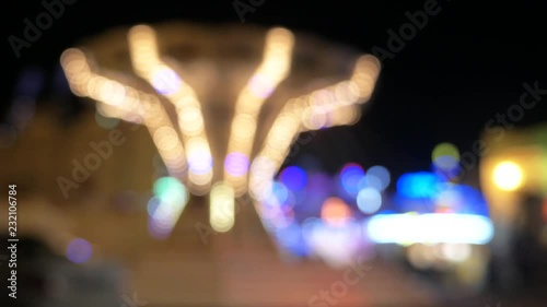 Holiday lights. The festive mood. Background. New Year. Christmas. Fair. Amusement park.   photo