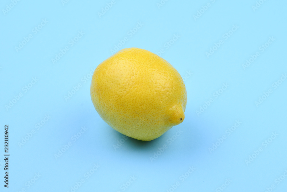 Lemon isolated on blue background. Space for test or design. Lemon isolated on blue background. Space for test or design.