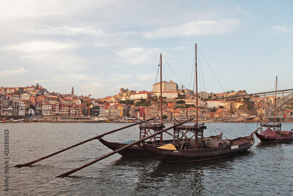 PORTO, PORTUGAL - November 24, 2014: traditional boats with wine barrels with  Porto city in the background