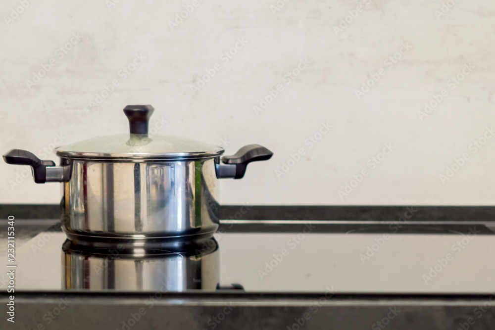 chrome pot on electric stove, modern black and white kitchen chrome pot on electric stove, modern black and white kitchen