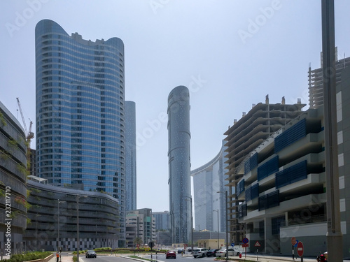 Shot of Al Reem island towers, landscape and construction sites on a clear blue sky