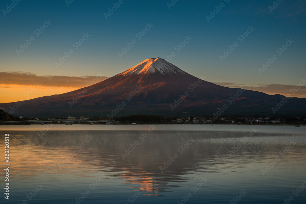 Mt. Fuji over Lake Kawaguchiko at sunrise in Fujikawaguchiko, Japan.