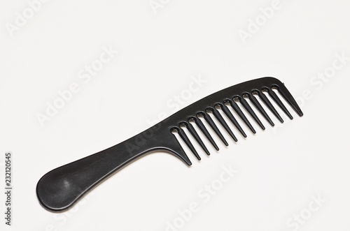 Black comb on white background