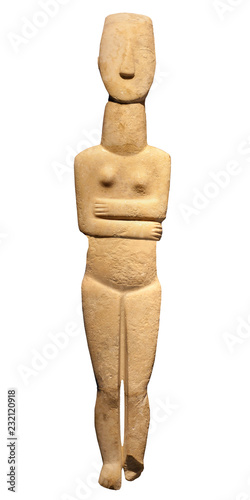 Ancient Cycladic art - Female stone figurine isolated on the white background photo