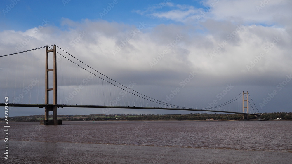 Humber Bridge, a single span suspension bridge spanning the River Humber, viewed from Barton-on-Humber, Lincolnshire looking back towards Hessle, Yorkshire, UK