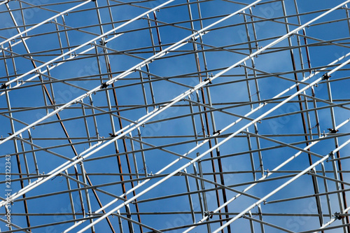 Metal scaffolding against blue sky