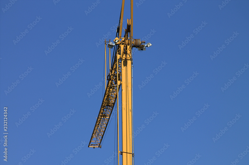 Yellow crane in the blue sky.