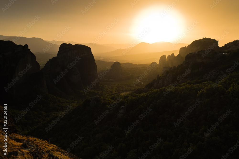 Huge rocks at sunset with Meteora valley in background, near Kalambaka, Thessaly, Greece