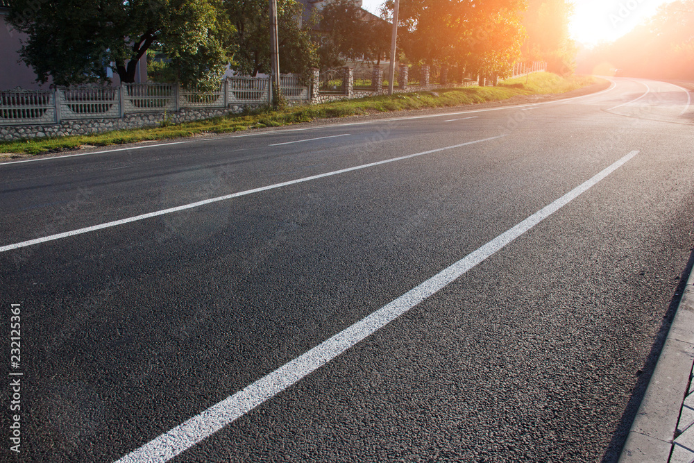 Asphalt road with marking lines white stripes