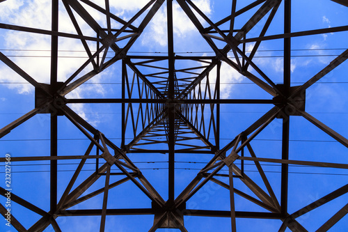 Big transmission tower high voltage power line, bottom view. Hazard concept, hazardous work, electric