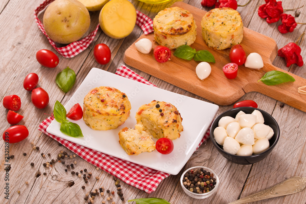 Potato gratins with mozzarella and tomatoes. Potato gratins with mozzarella and tomatoes.