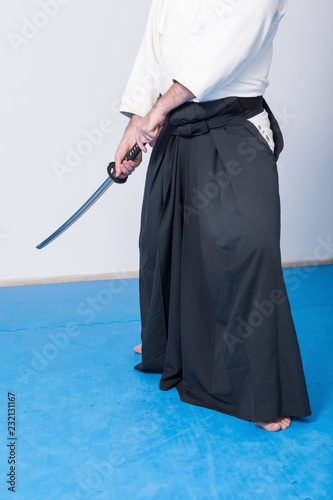 A man with katana on Iaido practice. Selective focus