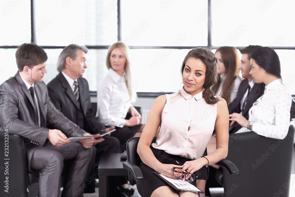 Naklejka premium business woman assistant on the background of the working group