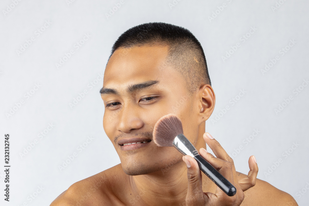 Men with makeup mustache, transform mascara, blush ,The guy with his face  brushes the brush.Men make up the separate background. Stock Photo | Adobe  Stock