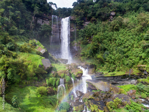 Beautiful waterfall.Tad Khamued Waterfall in southern Laos.It is a place to visit the natural beauty.Mountain forest fall landscape.Top view,Aerial view,waterfall amazing nature background,Rainfores