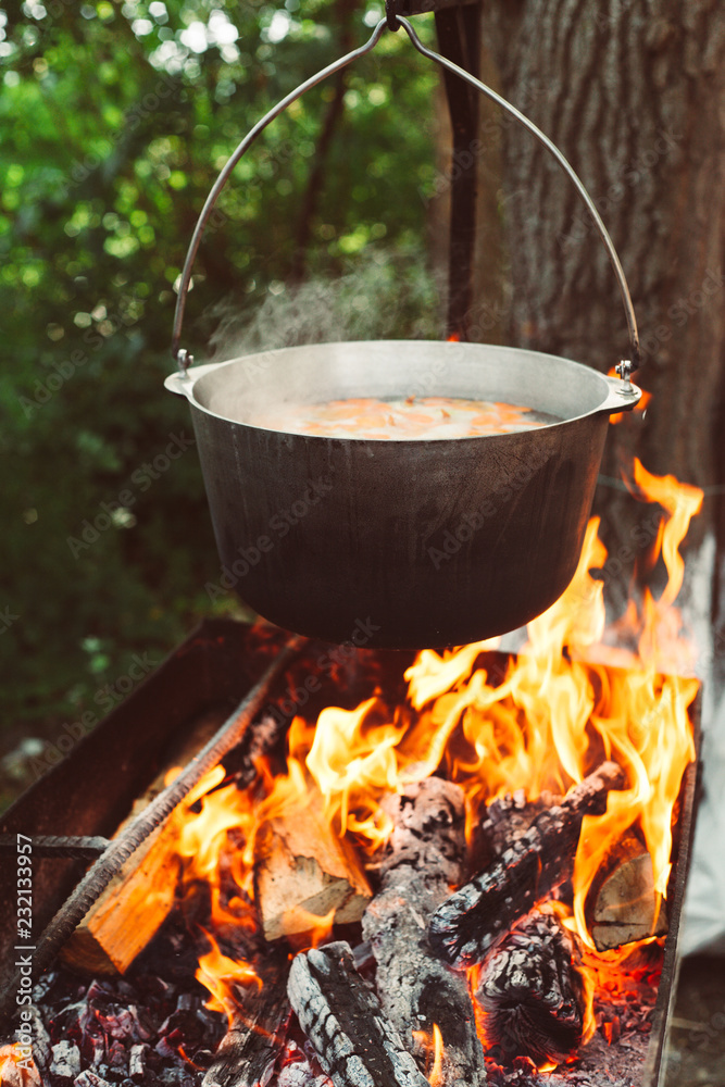 cooking in a pot on the fire in nature cooking in a pot on the fire in nature