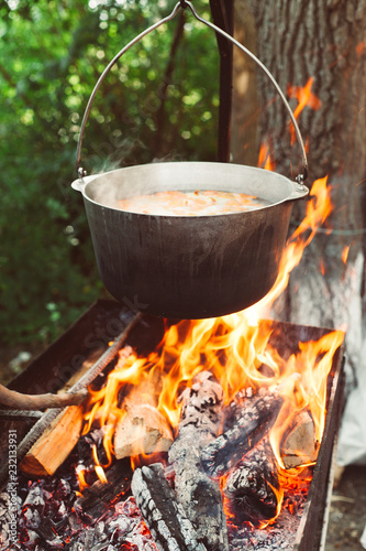 cooking in a pot on the fire in nature