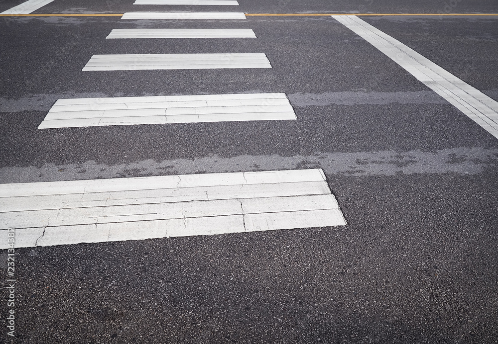 Street pedestrian crossroad in the city street. Traffic signs and symbols. Street pedestrian crossroad in the city street. Traffic signs and symbols.