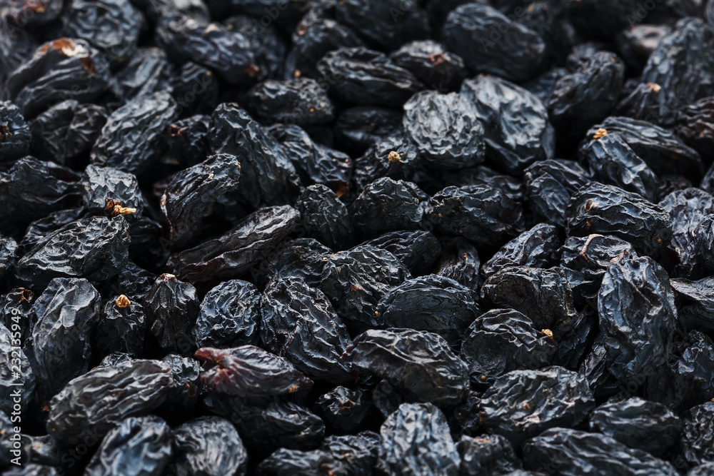 Black Raisin texture, popular dried fruit. Dried grapes. Black Raisin texture, popular dried fruit. Dried grapes.