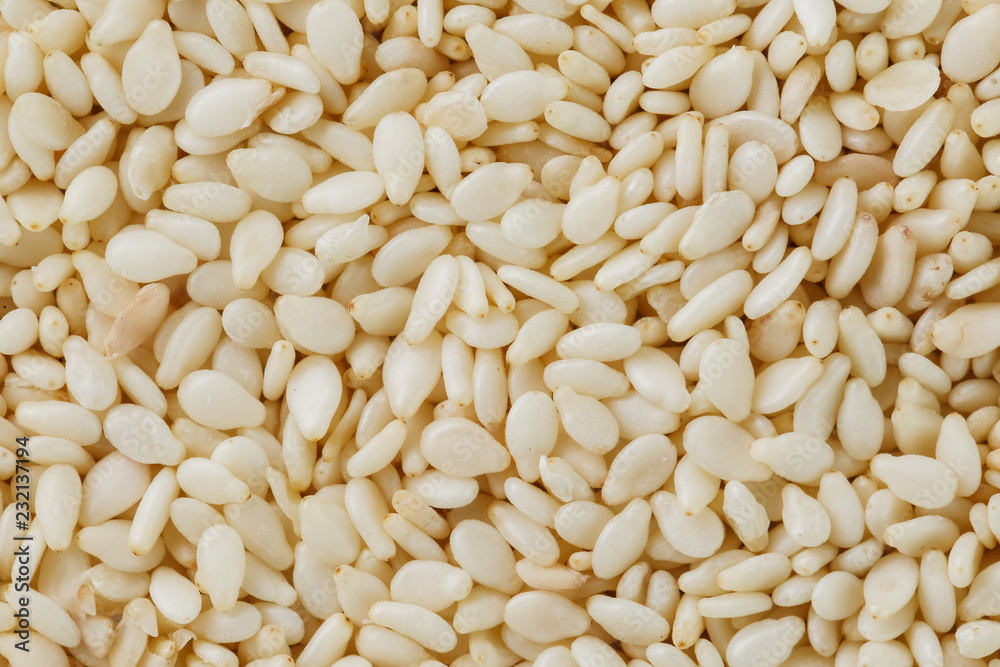 White sesame seeds background. Useful seeds for cooking White sesame seeds background. Useful seeds for cooking