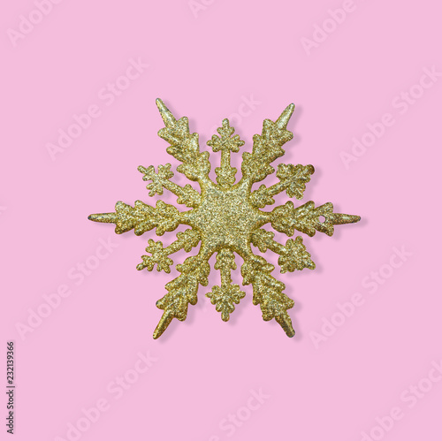 Golden christmas snowflake on pastel pink background, Christmas , New year greeting card photo