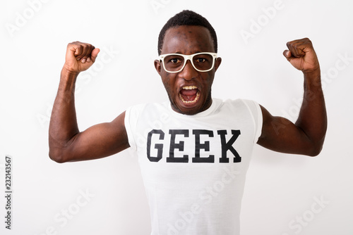 Studio shot of young black African nerd man wearing Geek shirt w