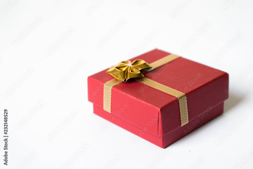 Red Gift Box Tied with Shiny Golden Ribbon Isolated Red Gift Box Tied with Shiny Golden Ribbon Isolated