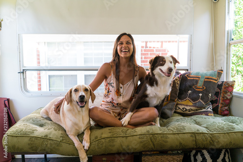 Woman sitting with two dogs
