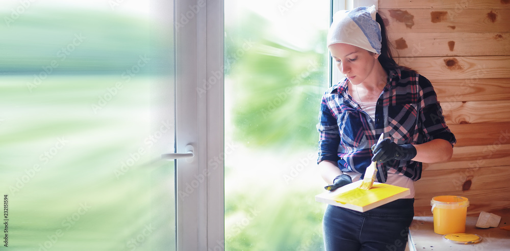 Woman with brush in a wooden house Woman with brush in a wooden house
