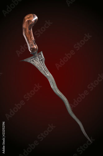 Fotografía Indonesian Traditional Weapon, Antique typical Indonesian kris knife, on red