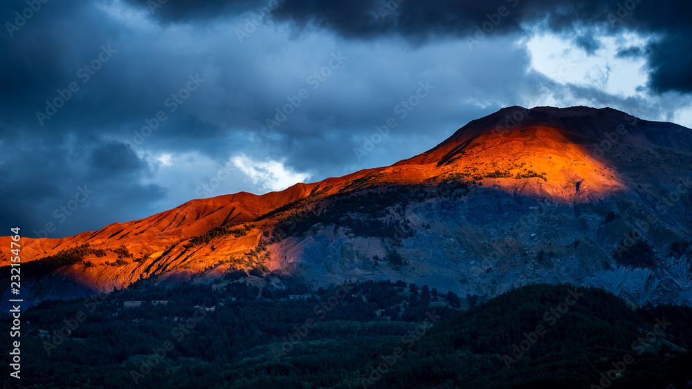 Fototapeta premium Maritime Alps in South of France illuminated by dramatic sunset light and skies