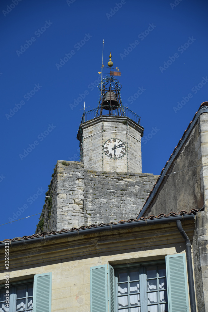 Clock tower in the main square of the medieval village of Uzes in the Gard region of Provence, France