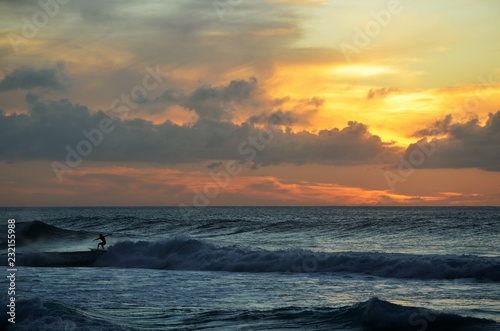 Surfers sunset