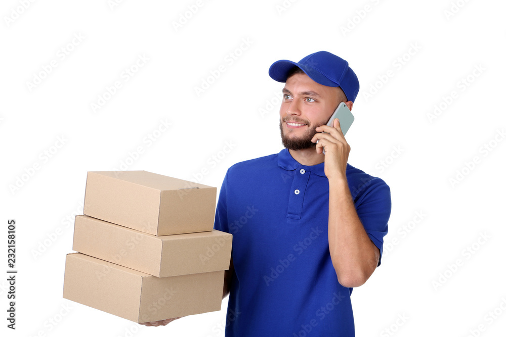 Delivery man with cardboard boxes and smartphone isolated on white background Delivery man with cardboard boxes and smartphone isolated on white background