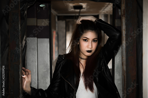 Portrait of asian with black leather dress punk style on train,Thailand people take a picture © reewungjunerr