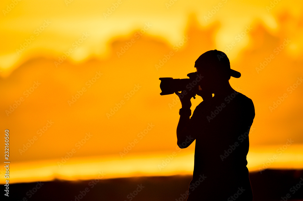 tourist with camera in the sunset tourist with camera in the sunset