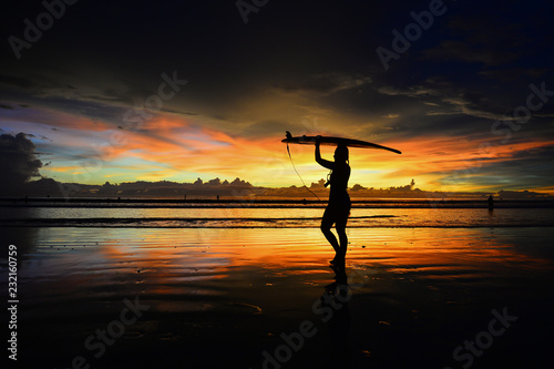 silhouette of surfboard player in the sunset (actual short)