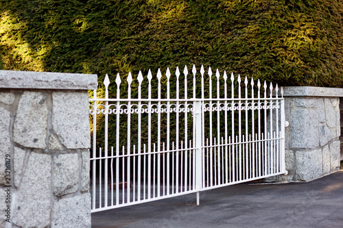 white metal fence in autumn