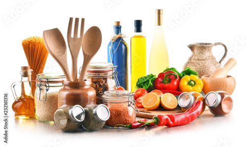 Assorted food products and kitchen utensils isolated on white