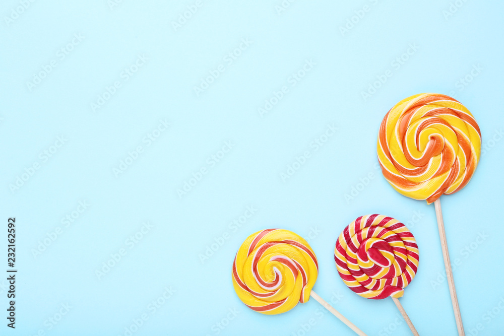 Colorful lollipops on blue background Colorful lollipops on blue background