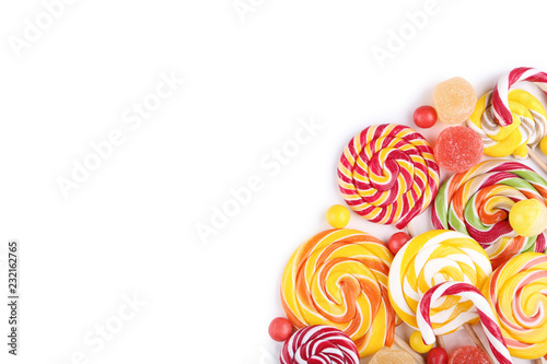 Sweet candies and lollipops on white background