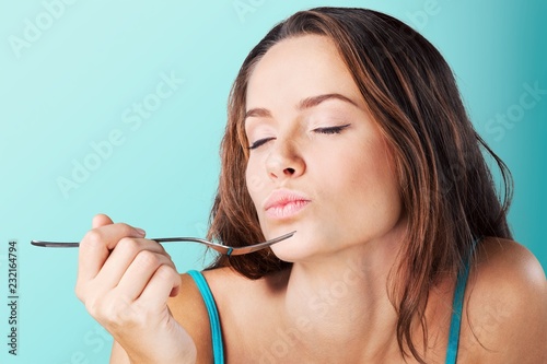 Young beautiful woman with  fork