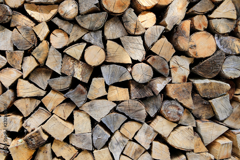 Firewood pile stacked chopped wood trunks Firewood pile stacked chopped wood trunks