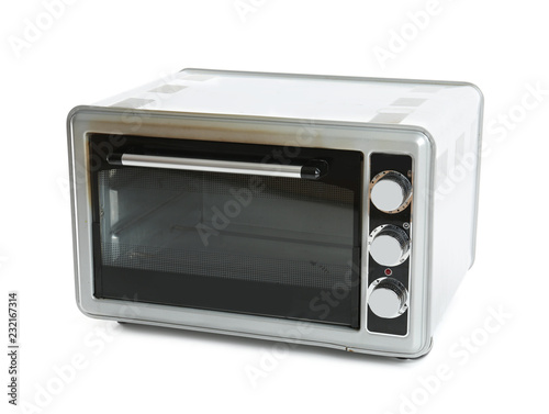 Dirty modern electric oven on white background