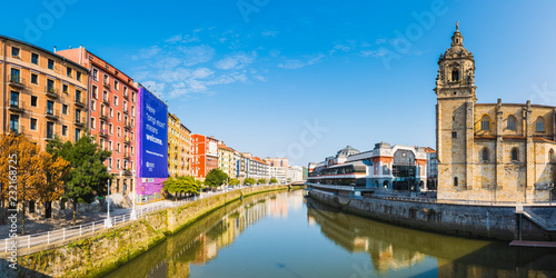 Spain, Basque Country, Bilbao. Nervion river and the Mercado de la Ribera market. photo