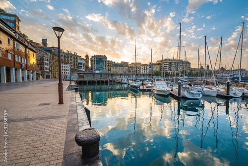 Spain, Basque Country, San Sebastian (Donostia). Harbour at sunrise.