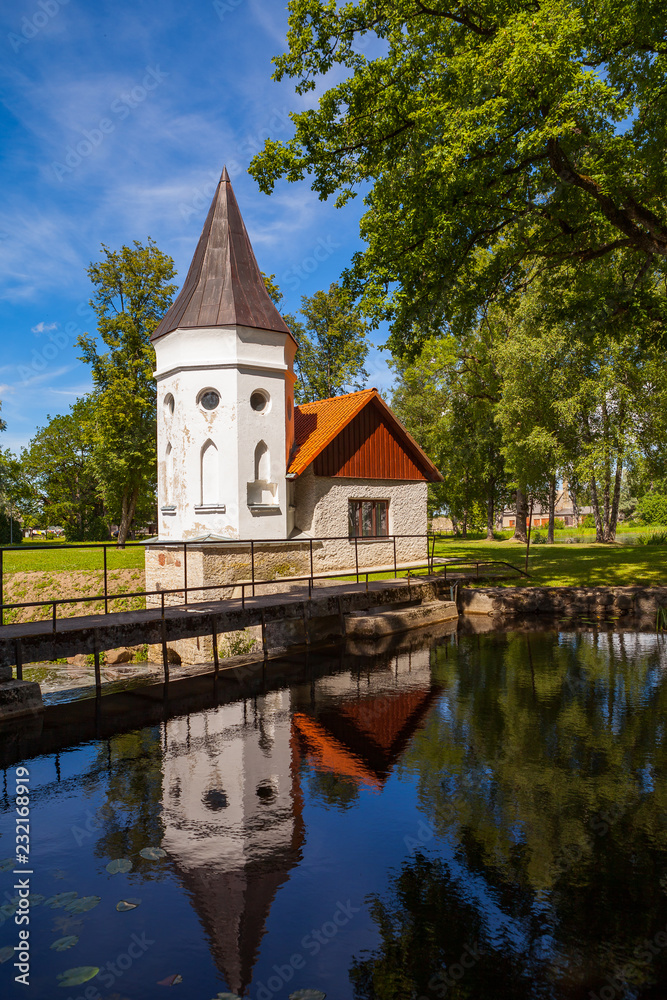 White castle Koluvere - saved medieval theasure of Estonia. Guard small house